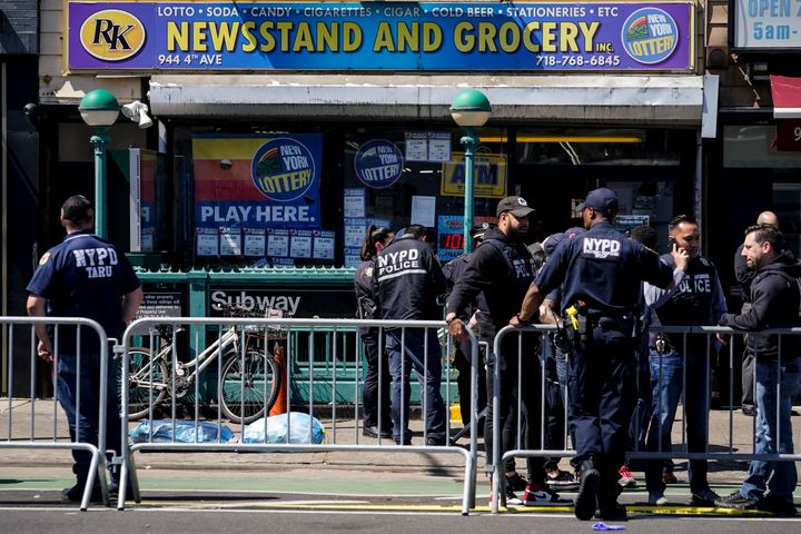 Emergency personnel gather at the entrance to a subway stop in the Brooklyn borough of New York on Tuesday.