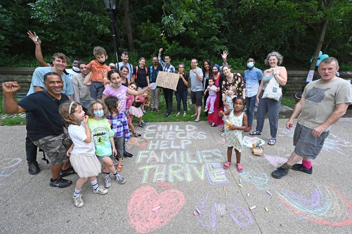 Parents and children in Brooklyn, New York, celebrated monthly Child Tax Credit payments and urged Congress to make them permanent outside Senate Majority Leader Chuck Schumer's (D-N.Y.) home on July 12, 2021.