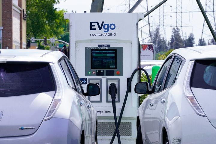 Electric cars are parked at a charging station in Sacramento, Calif., Wednesday, April 13, 2022.