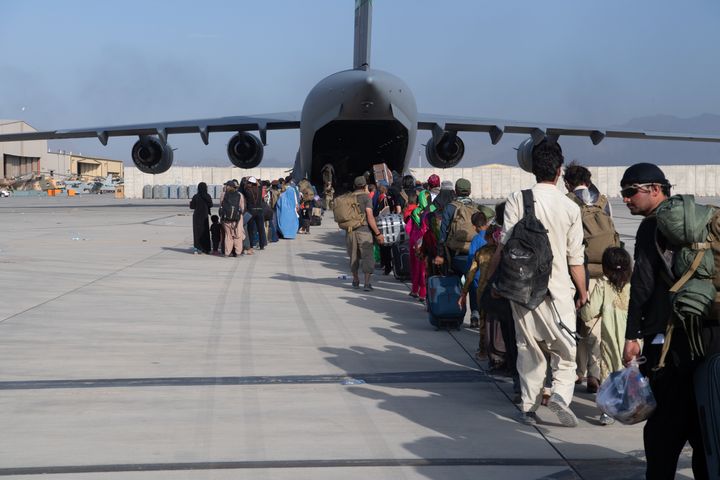 U.S. Air Force loadmasters and pilots assigned to the 816th Expeditionary Airlift Squadron load passengers aboard a U.S. Air Force C-17 Globemaster III in support of the Afghanistan evacuation at Hamid Karzai International Airport on August 24, 2021 in Kabul, Afghanistan.