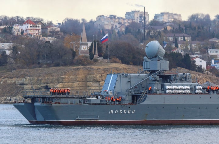 Russian navy officers line up on the deck as the guided missile cruiser Moskva (Moscow) sails back into a harbour after tracking NATO warships in the Black Sea, in the port of Sevastopol, Crimea November 16, 2021. REUTERS/Alexey Pavlishak