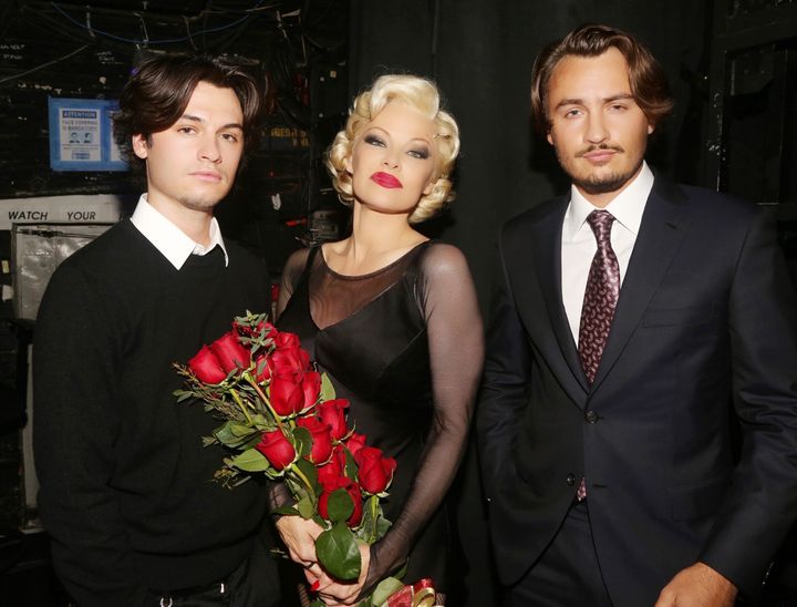 Dylan Jagger Lee, Pamela Anderson and Brandon Thomas Lee pose backstage during the opening night of "Chicago" Tuesday.