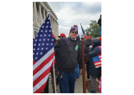 Thompson pictured alongside his prize, a coat rack.