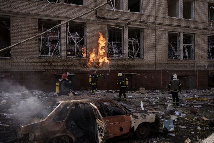 Firefighters work to put out multiple fires after a Russian attack in Kharkiv, Ukraine, Saturday, April 16, 2022. 