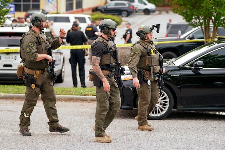 Authorities stage outside Columbiana Centre mall in Columbia, South Carolina, following a shooting Saturday.