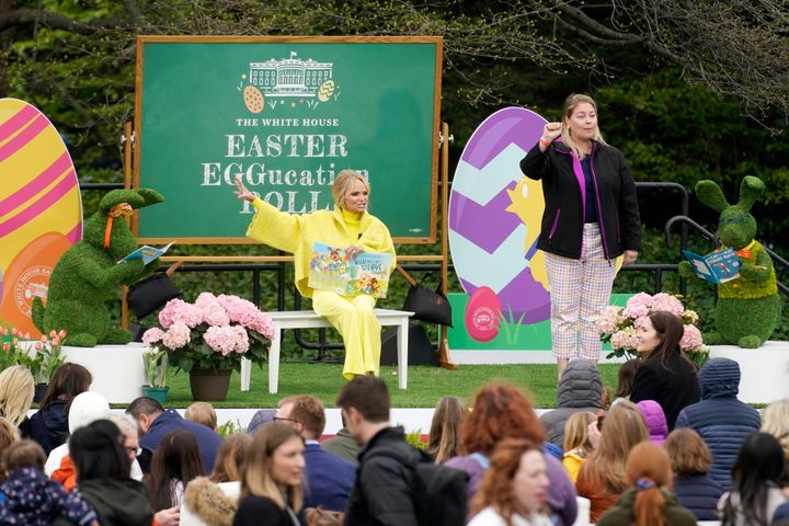 Actress Kristin Chenoweth reads to children during the White House Easter Egg Roll, Monday, April 18, 2022, at The White House in Washington. (AP Photo/Andrew Harnik)
