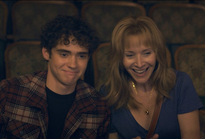 Anthony (Joshua Bassett) and Aunt Heidi (Lisa Kudrow) cheer on Nate from afar.