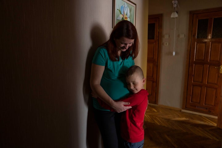 Pregnant Marta holds her 6-year-old son Nazar, at an apartment given to them by a cousin on April 3. Her birth plan, like almost everything else, was left behind. (AP Photo/Nariman El-Mofty)