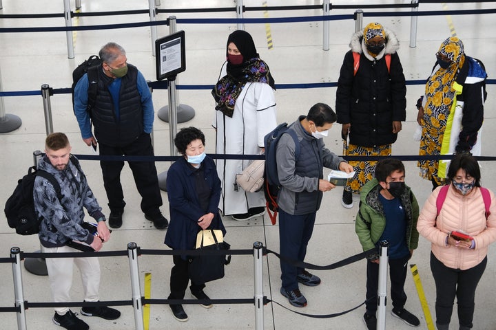 People stand in a security line at John F. Kennedy Airport on April 19, 2022 in New York City. 