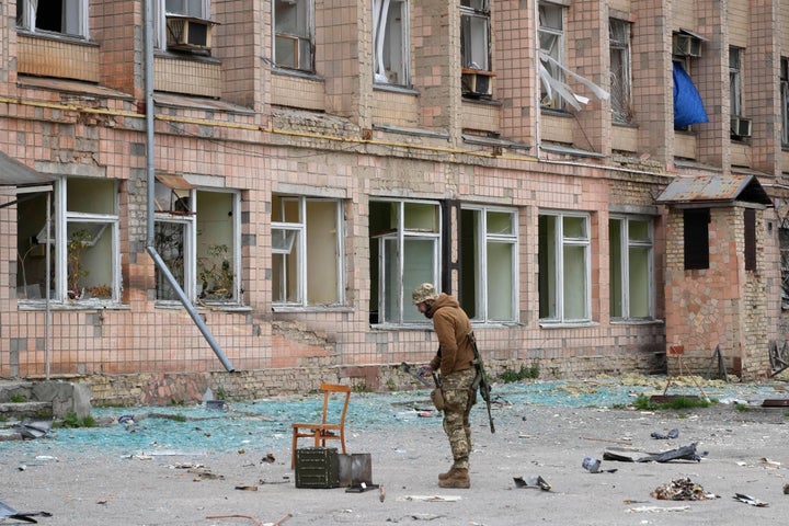 A Ukrainian soldier stands near the State Department of Nuclear Waste near the Chernobyl Nuclear Power Plant in Ukraine on April 16, 2022.