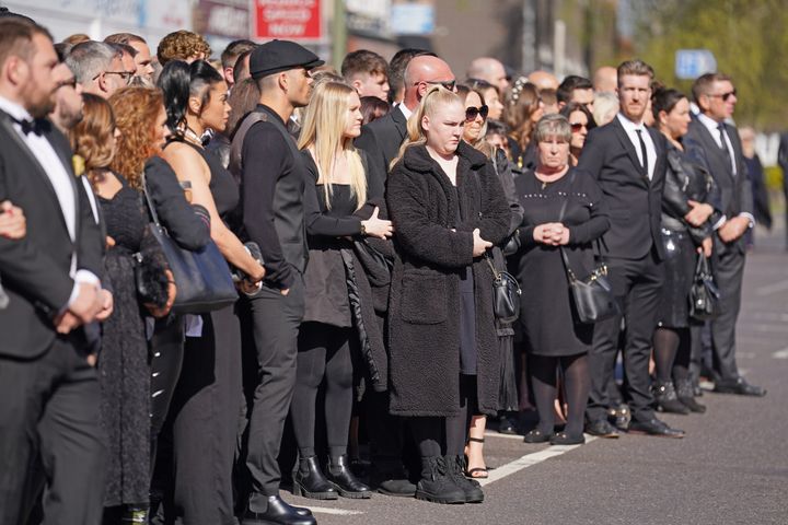 Fans pay their respects on the morning of Tom's funeral