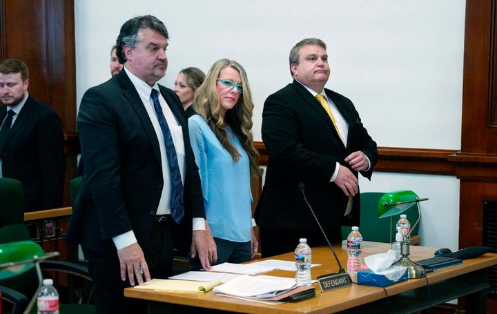 Lori Vallow Daybell, center, listens during a court hearing in St. Anthony, Idaho, on Tuesday. She refused to enter a plea to murder and other charges on Tuesday, prompting an Idaho judge to enter a not guilty plea on her behalf.