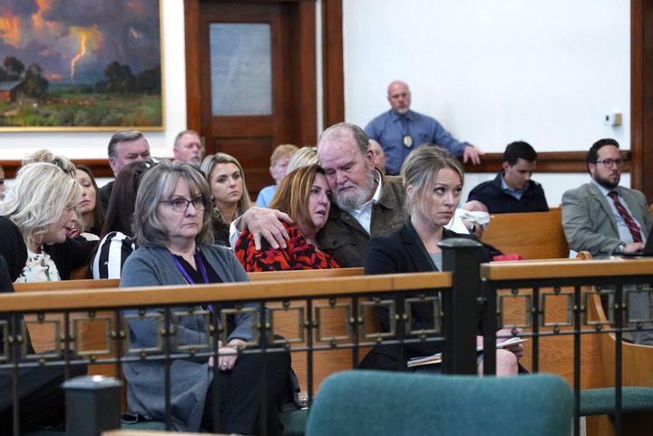 Larry and Kay Woodcock, center, the grandparents of Joshua "JJ" Vallow, listen during a court hearing for Lori Vallow Daybell on Tuesday.