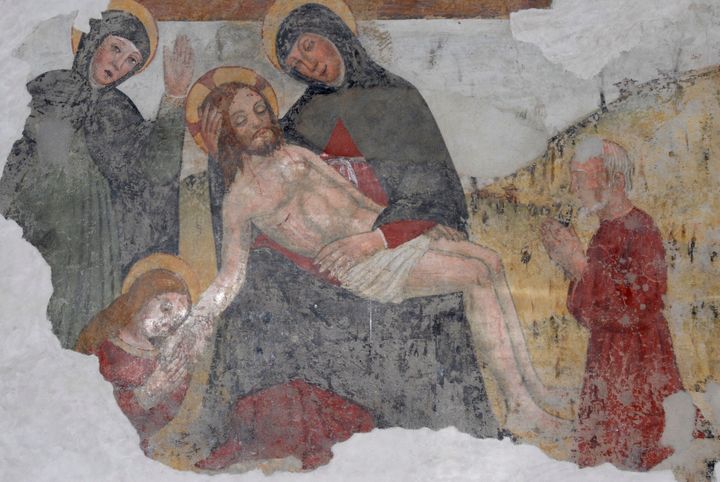 The Pieta, Mary crying over the body of the dead Christ, fresco in the church of Saint Michael Arcangelo, Roncole Verdi, Emilia-Romagna, Italy, 16th century.