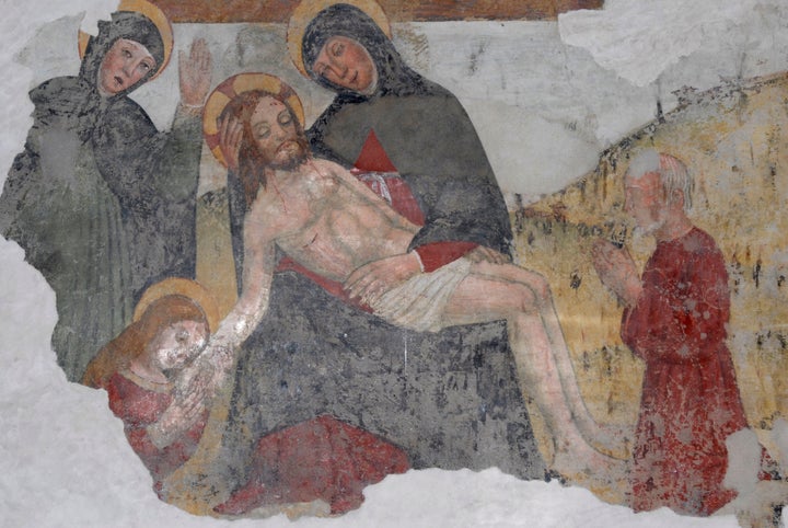 The Pieta, Mary crying over the body of the dead Christ, fresco in the church of Saint Michael Arcangelo, Roncole Verdi, Emilia-Romagna, Italy, 16th century.