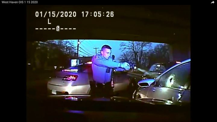 An image from dashboard camera video released by the Connecticut State Police shows Trooper Brian North after discharging his weapon and fatally shooting Mubarak Soulemane in January 2020.
