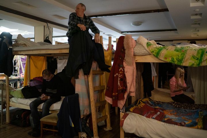Nikolay Godin, 65, who left his home in Severodonetsk due to the Russian attacks, sits at the top bunk settled in a restaurant that was transformed into a shelter for those who are fleeing the war from the eastern region of the country in Dnipro, Ukraine, on April 20, 2022.