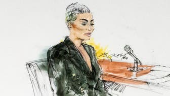 Former reality television star Blac Chyna sits in court in Los Angeles on Tuesday. She has accused the Kardashian family of destroying her TV career.