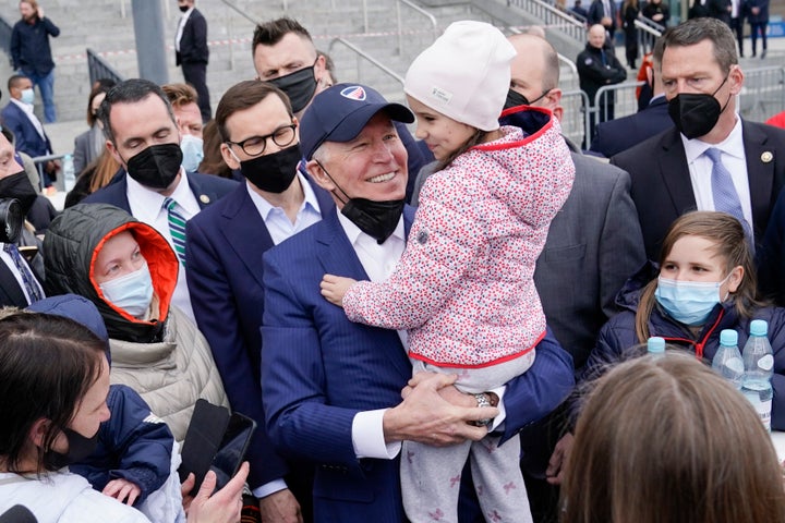 President Joe Biden meets with Ukrainian refugees in Warsaw. His administration is starting a new program to streamline refugee applications for those fleeing the war.