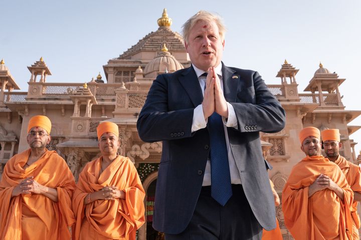 Boris Johnson walks with sadhus, Hindu holymen, as he visits the Swaminarayan Akshardham temple in Gandhinagar, Ahmedabad, as part of his two day trip to India. 