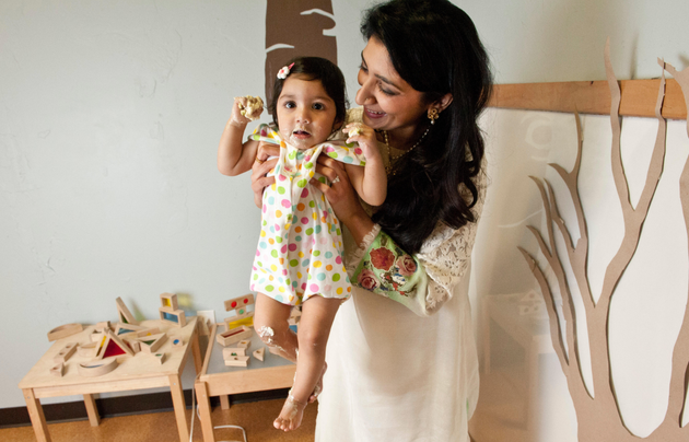 The author with Rehma at her first birthday party in January 2013, after she had dug into her cake. Rehma died a few days later.