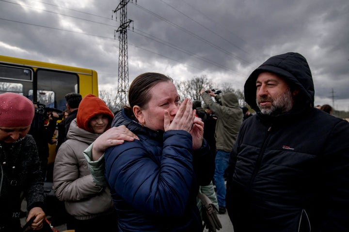 People fleeing the fighting in the southern city of Mariupol are meeting relatives and friends after a humanitarian corridor opens.