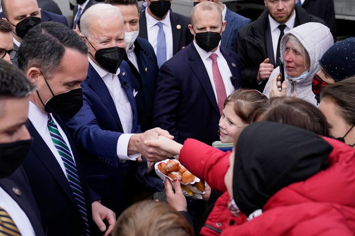 President Joe Biden meets with Ukrainian refugees and humanitarian aid workers during a visit to PGE Narodowy Stadium, Saturday, March 26 in Warsaw.