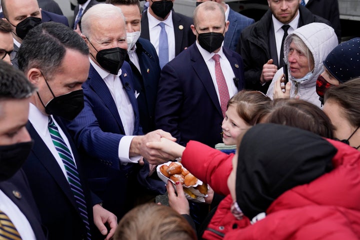 President Joe Biden meets with Ukrainian refugees and humanitarian aid workers during a visit to PGE Narodowy Stadium, Saturday, March 26 in Warsaw.