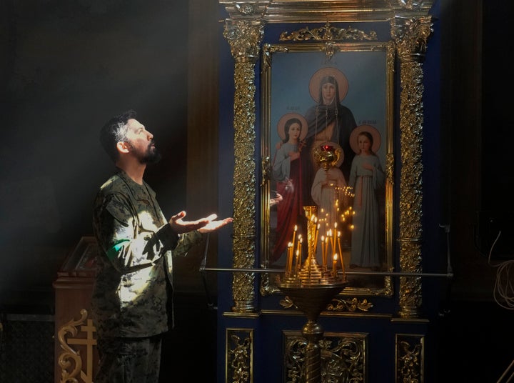 A Ukrainian soldier prays in St. Michael Cathedral during Orthodox Easter celebrations in Kyiv, Ukraine, on April 24, 2022.