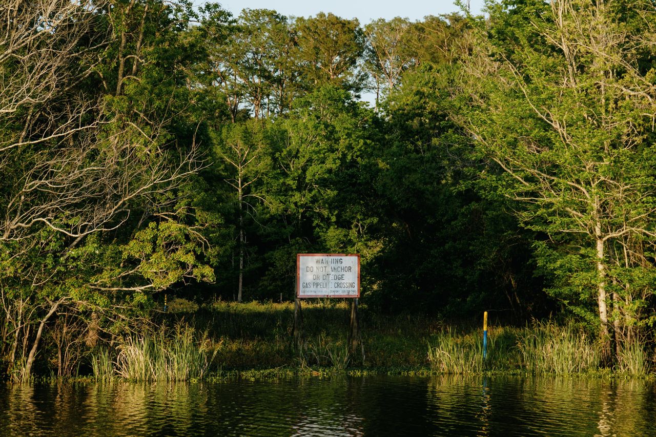 A sign warns of a gas pipeline in Bayou Sorrel. Pipelines for oil, gas and chemical products crisscross southern Louisiana, laid in dredged-out canals that have blocked natural water flows through the Atchafalaya Basin.