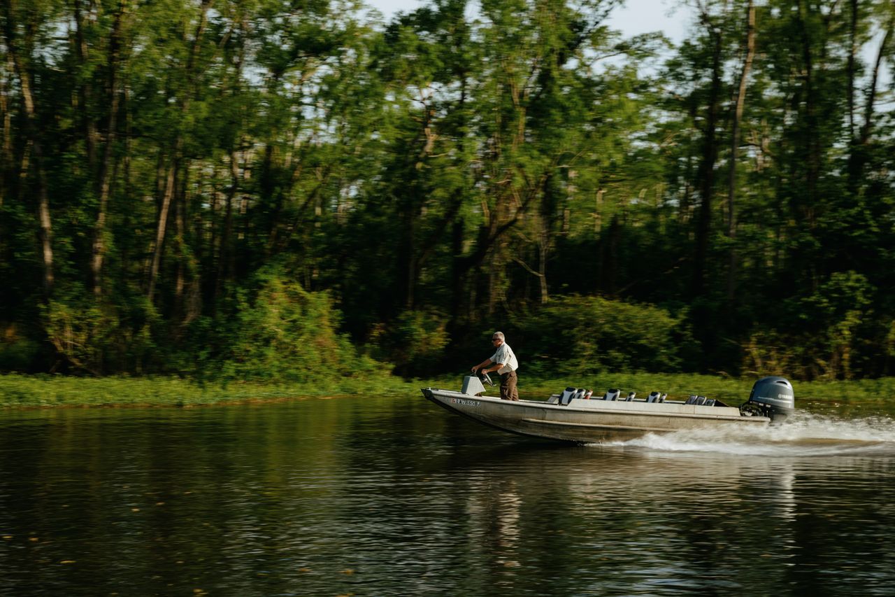 Dean Wilson, head of the Atchafalaya Basinkeeper, guides his boat through human-made canals in the basin.