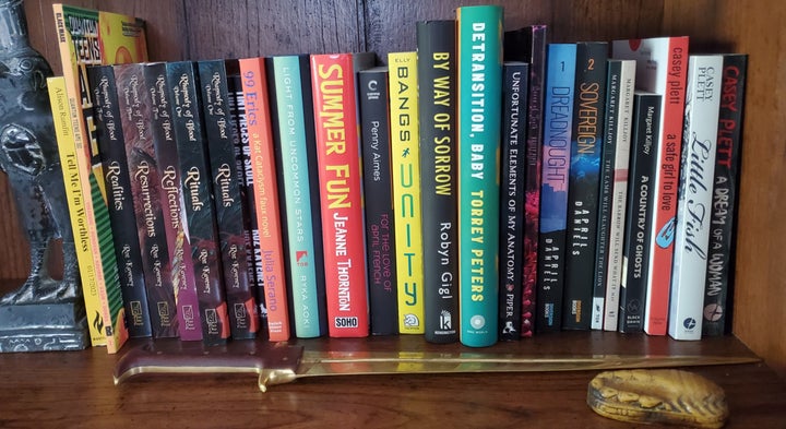 A whole shelf of trans women's literature.