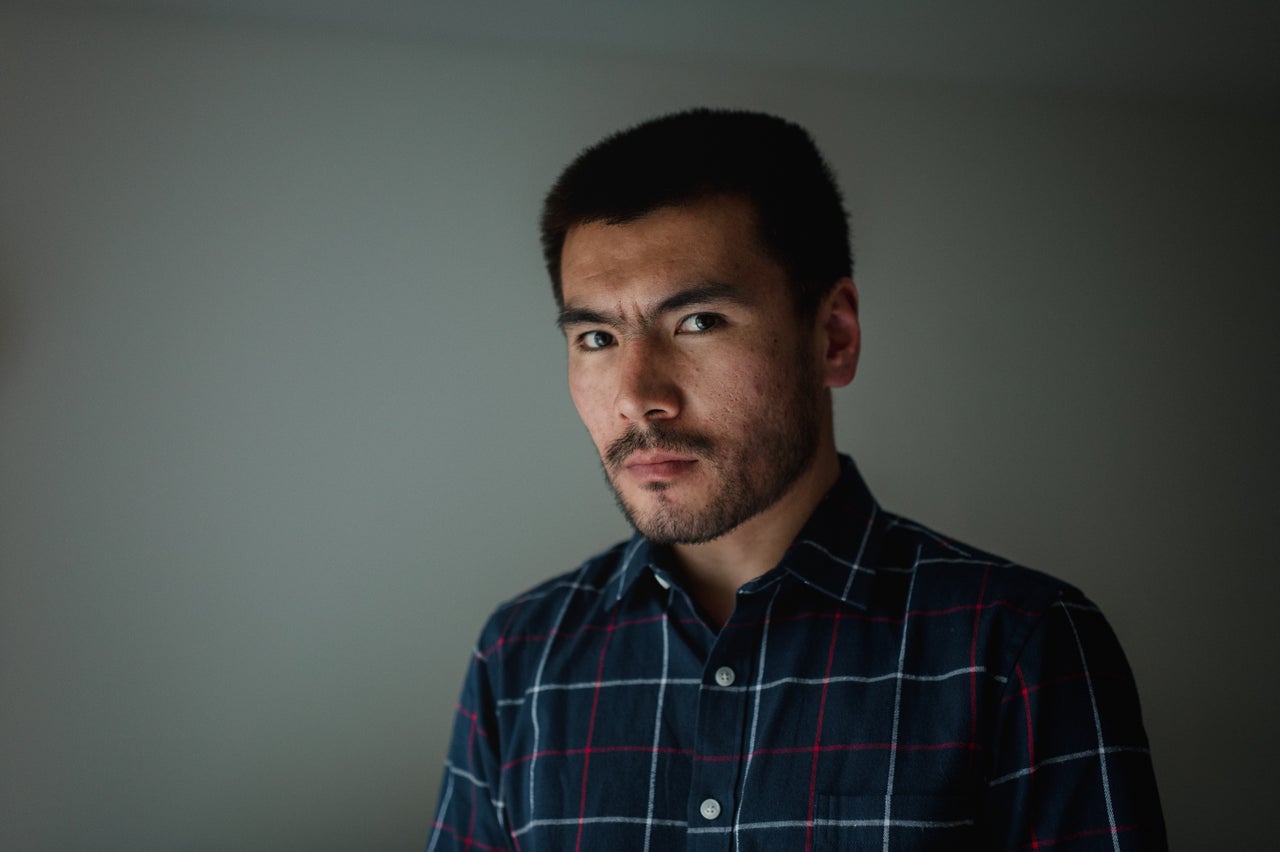 Naqdi sits for a portrait at his home in Bethlehem, Pennsylvania, on April 23. He has been living in Bethlehem for three months with his wife.