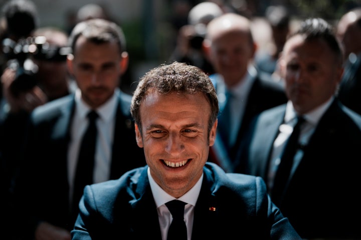 Emmanuel Macron greets well-wishers after casting his vote in Le Touquet, northern France.