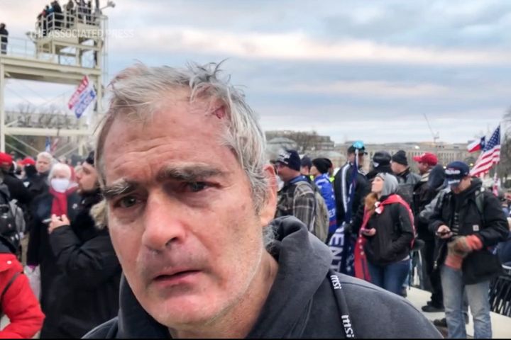 This image from video recorded Jan. 6, 2021, captures Vincent Gillespie on the grounds of the U.S. Capitol in Washington where prosecutors say he was among a rioting mob trying to gain control of the building from the federal government. 