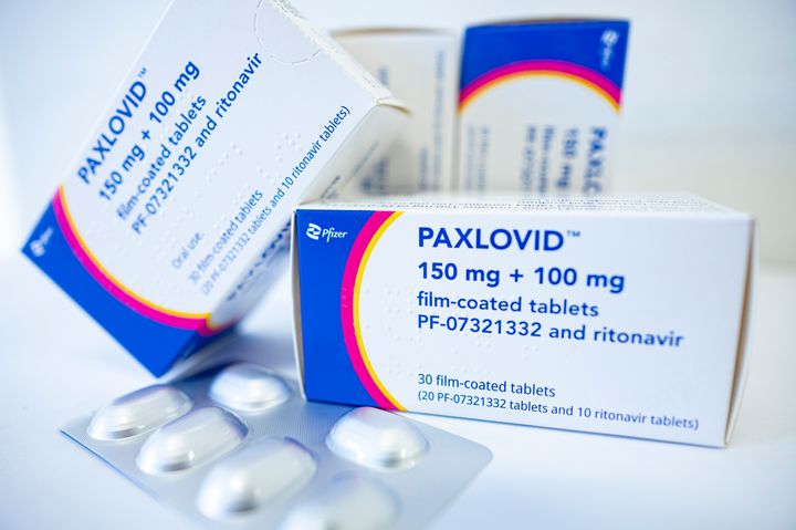 The drug Paxlovid against COVID.=-19 from the manufacturer Pfizer is lying on a table. 