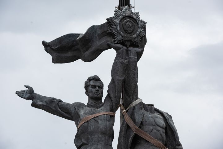  Figures from the 'Friendship of Peoples' monument are taken down during its demolition on April 26, 2022 in Kyiv, Ukraine.