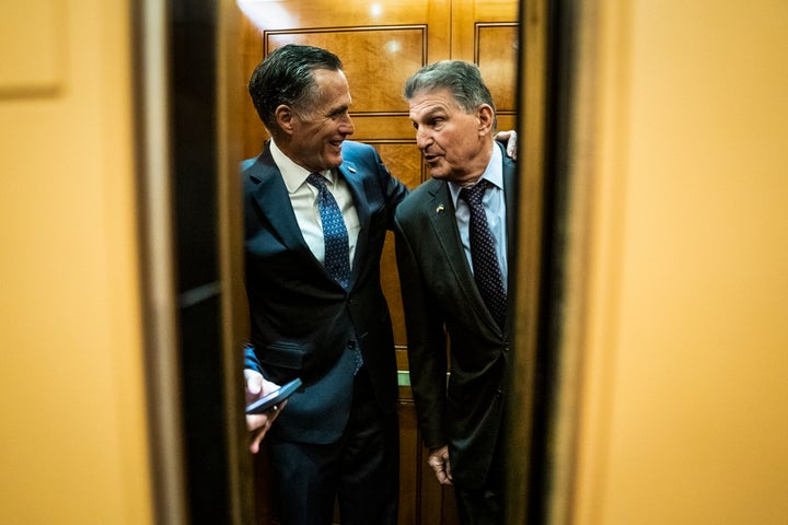 Sen. Mitt Romney, shown here in March with Sen. Joe Manchin (D-W.Va.), has been a key player in the Senate recently, but he has no plans to run for president in 2024.