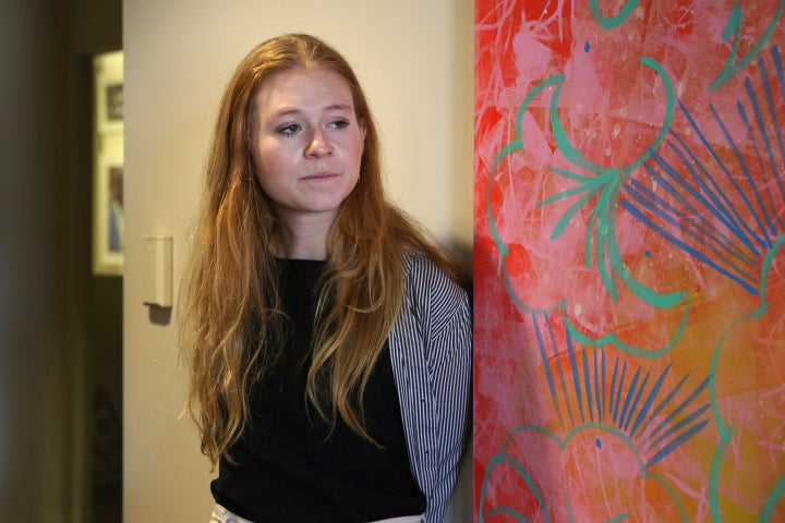 Elizabeth Stone, a restaurant server, poses for a photo at the office of Restaurant Opportunities Centers United, a restaurant workers' advocacy group, in New York, on April 11, 2022.