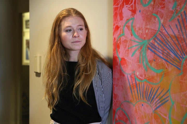 Elizabeth Stone, a restaurant server, poses for a photo at the office of Restaurant Opportunities Centers United, a restaurant workers' advocacy group, in New York, on April 11, 2022. 