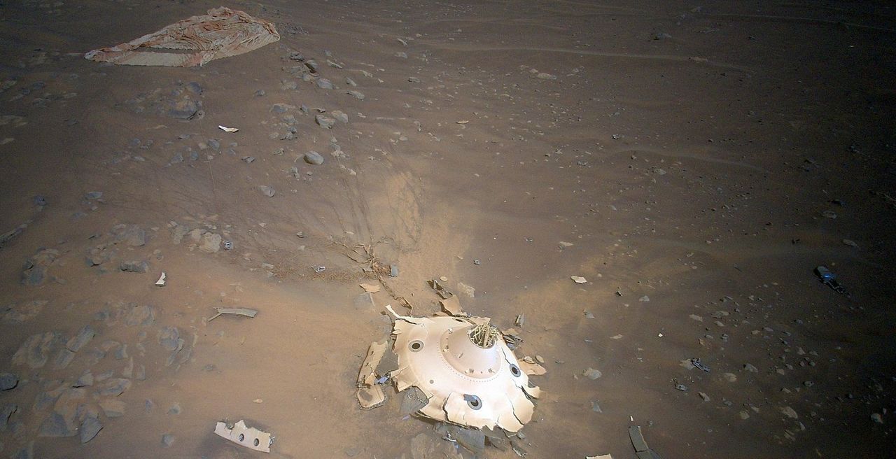 Cables emerge from the backshell to the supersonic parachute that brought the Ingenuity helicopter and Perseverance rover to Mars.