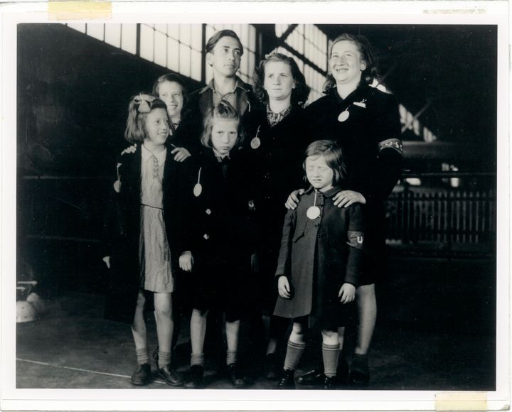 In this May 26, 1946, photo, Ginger Lane, bottom right, and her siblings arrive in New York City as Holocaust survivors who were hidden in a fruit orchard near Berlin by non-Jews.