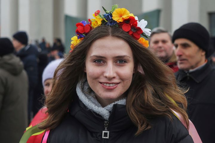 A woman poses for a photo during a rally against the Russian occupation in Svobody (Freedom) Square in Kherson, Ukraine, on March 8, 2022.