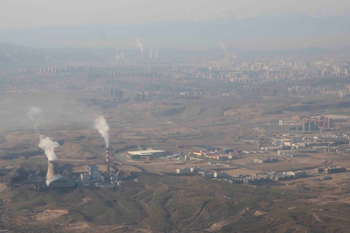 Smoke and steam rise from towers at the coal-fired Urumqi Thermal Power Plant in Urumqi in western China's Xinjiang Uyghur Autonomous Region.