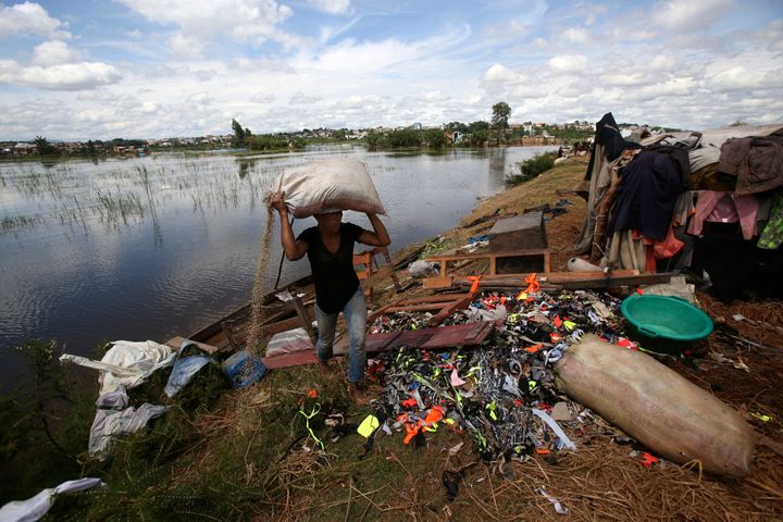 A man caries belongings from his house destroyed by tropical storm Ana in Antananarivo, Madagascar, on Jan. 26. Extreme rainfall in Africa's southeast has become heavier and more likely to occur during cyclones because of climate change, according to one recent analysis released by an international team of weather scientists.