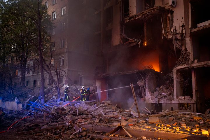 In the attack on Kyiv, explosions shook the city and flames poured out the windows of the residential high-rise and another building. 