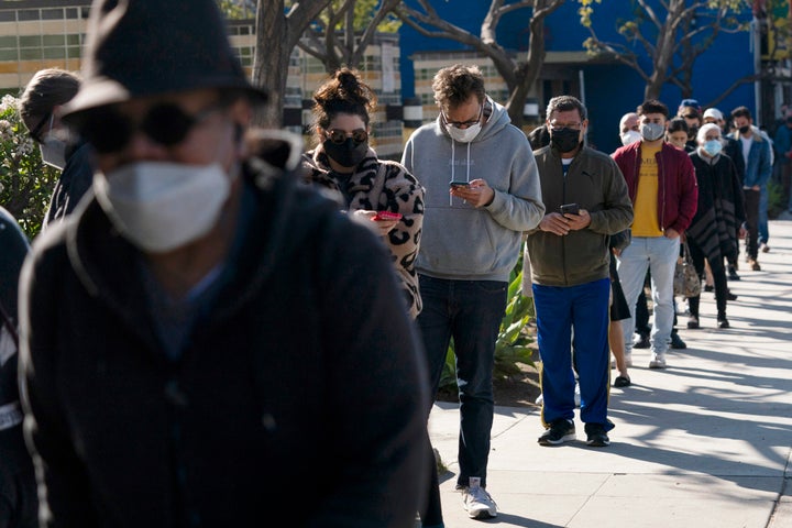 People wait in line for a COVID-19 test in Los Angeles, on Jan. 4, 2022.