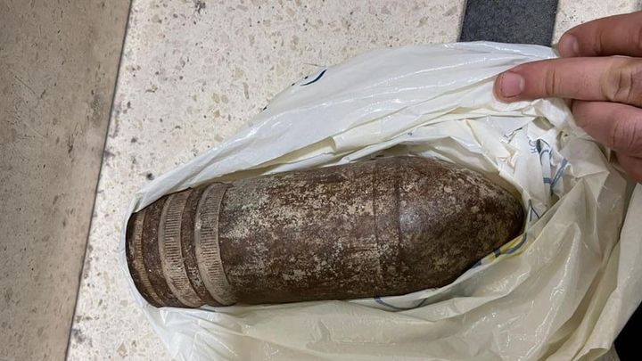 An unexploded bomb is secured by the Israel Airports Authority at Ben Gurion Airport in Tel Aviv on Thursday.