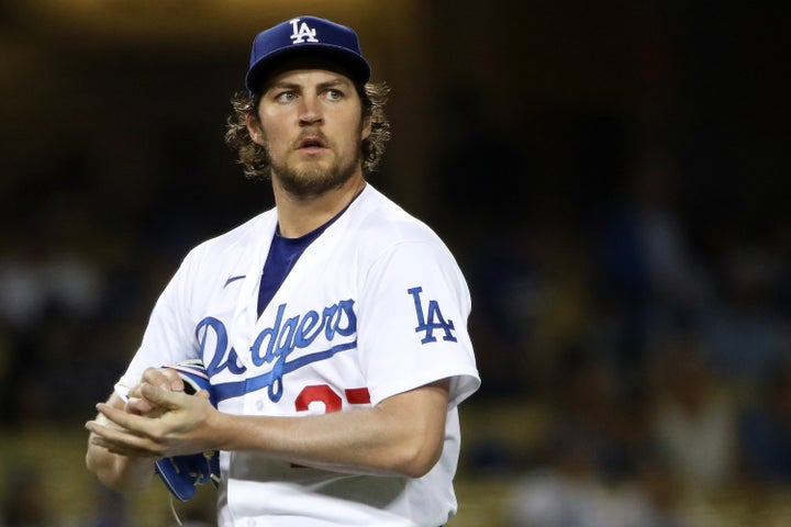 Trevor Bauer #27 of the Los Angeles Dodgers looks on after giving up a hit to Joey Gallo #13 of the Texas Rangers during the fifth inning at Dodger Stadium on June 12, 2021 in Los Angeles, California.