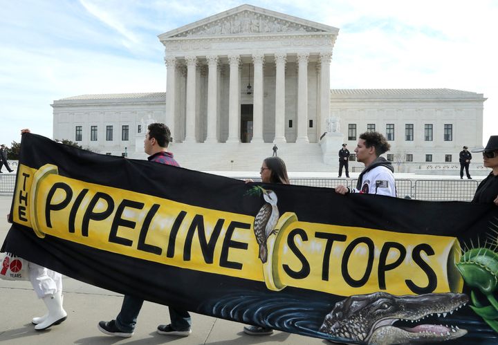 Climate activist groups protest the Atlantic Coast Pipeline in front of the Supreme Court in February 2020. Duke Energy Corp. and Dominion Energy Inc., the companies behind the controversial project, canceled it later that year “due to ongoing delays and increasing cost uncertainty.” 